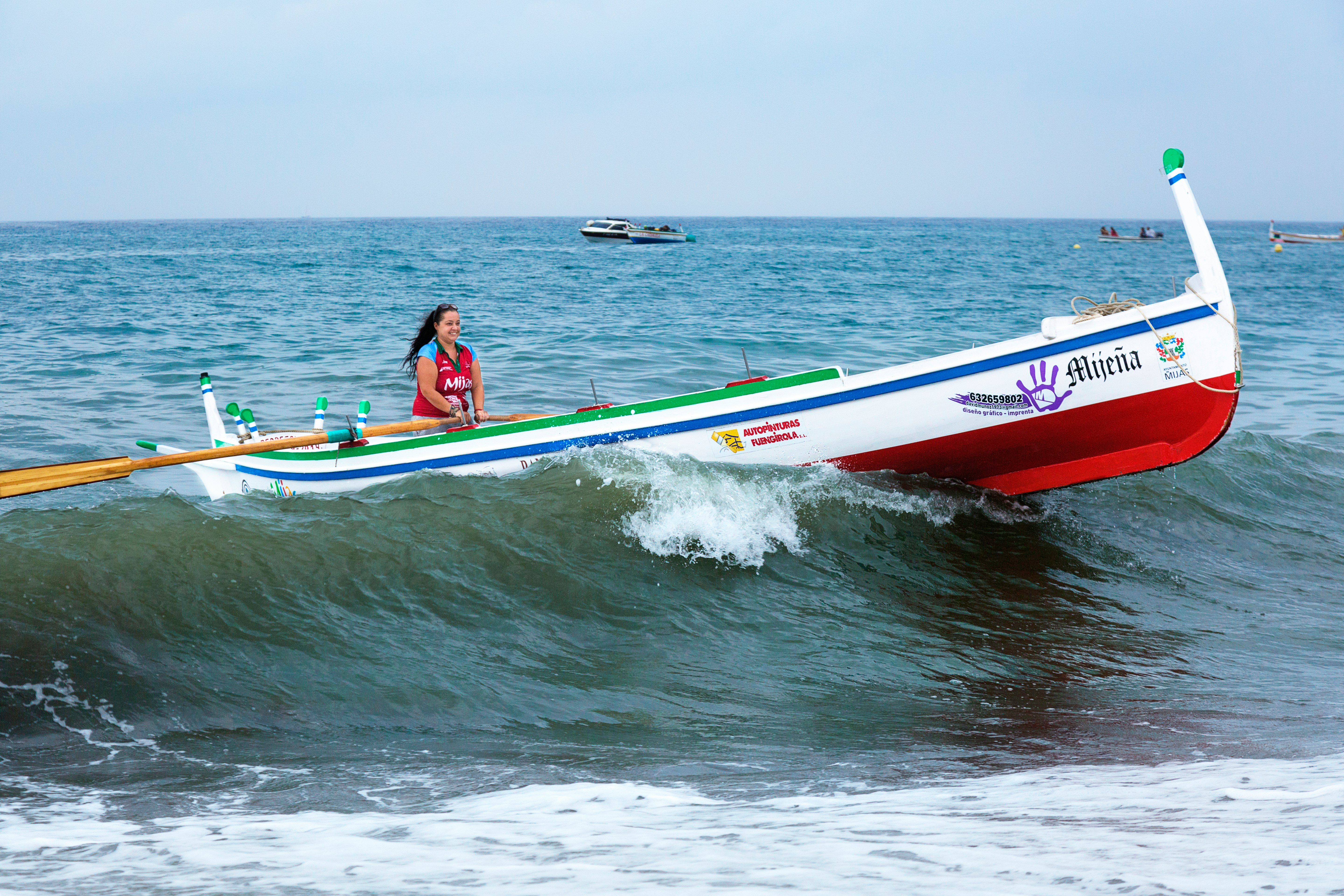 woman riding on white boat